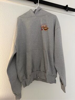 Classic Gray Pullover Hoodie with Small Embroidered Graphic